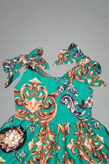 girls green sleeveless dress with bow straps