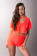 orange short sleeve crop top and high waist shorts