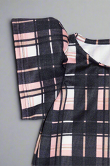 close up short puff sleeve pink and black check dress