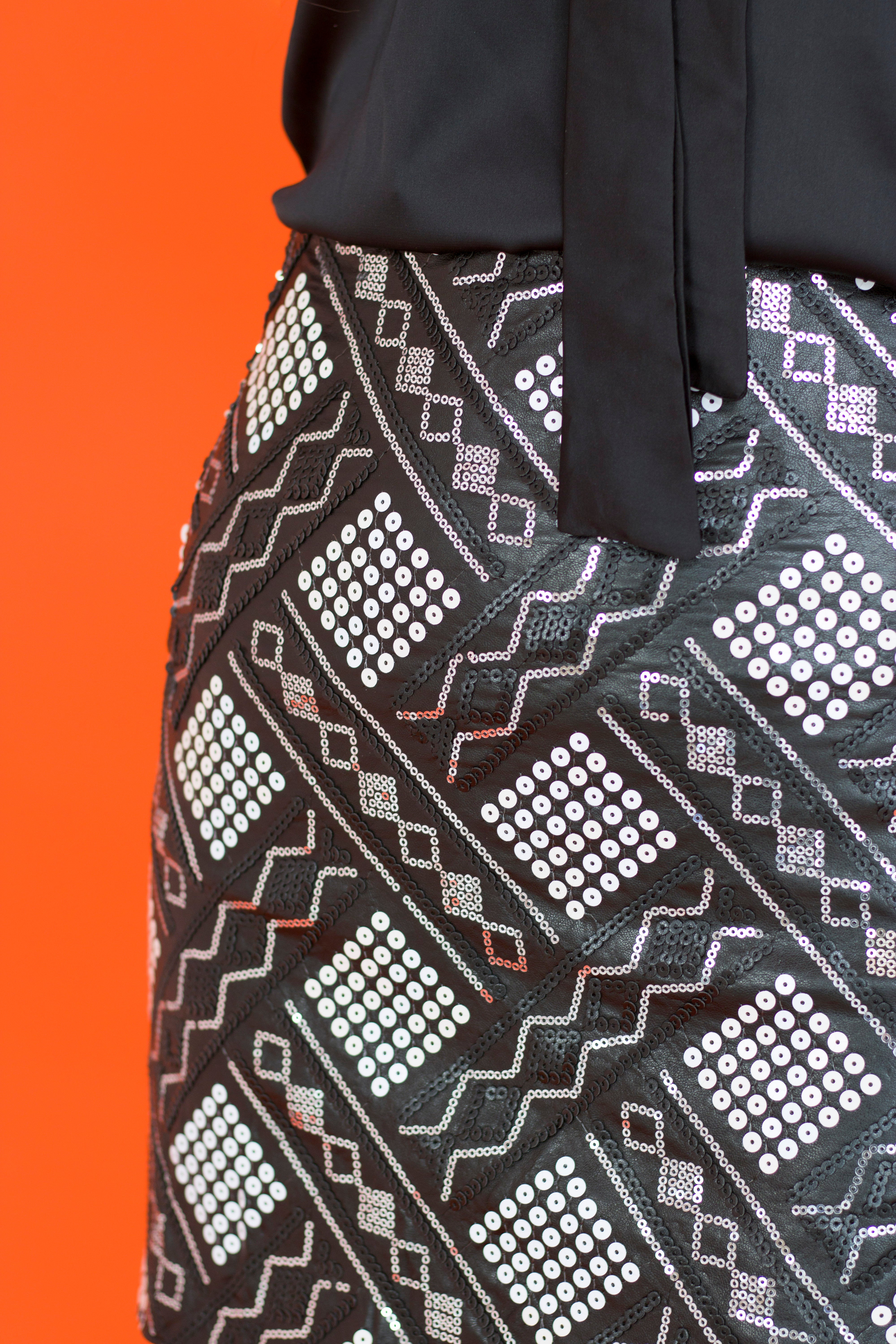 close up black faux leather sequin fabric