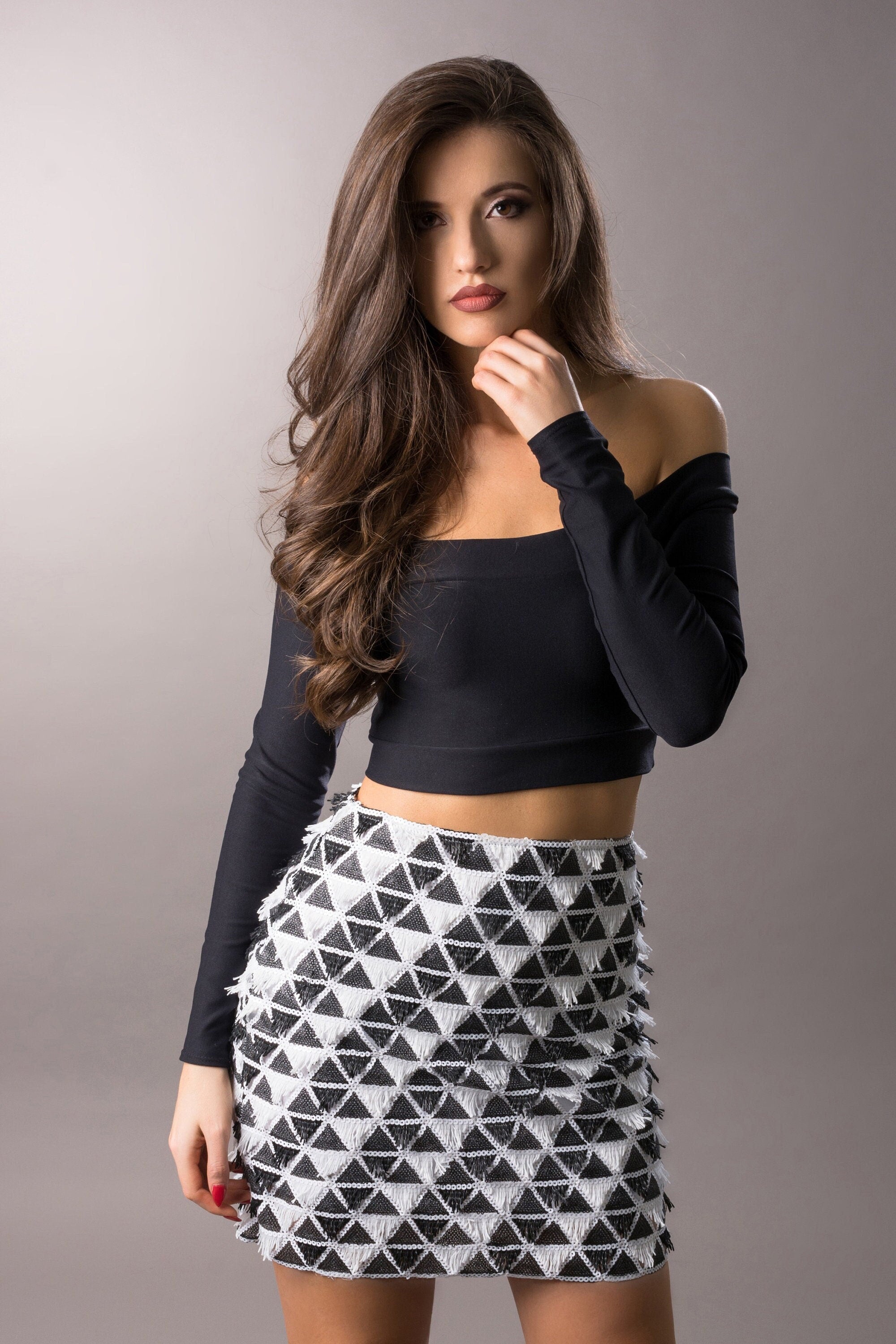 woman wearing black and white sequins skirt